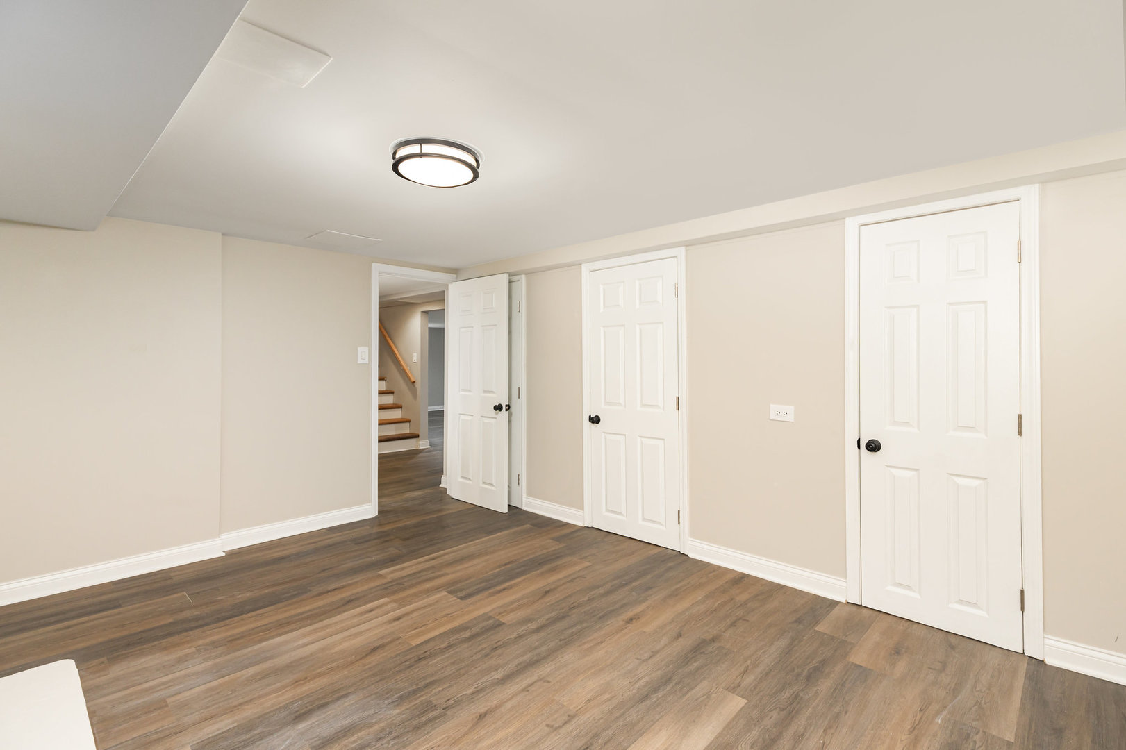 7332 South Honore Street Chicago, IL 60636 - Photo 8 of 27 a view of an empty room with wooden floor