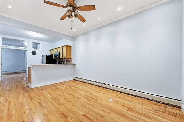 a view of a kitchen with a sink and cabinets