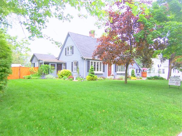 38 Granger Street Springfield, MA 01119 - Photo 1 of 30 a front view of a house with a garden