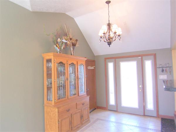 38 Granger Street Springfield, MA 01119 - Photo 11 of 30 a view of a hallway with windows and chandelier