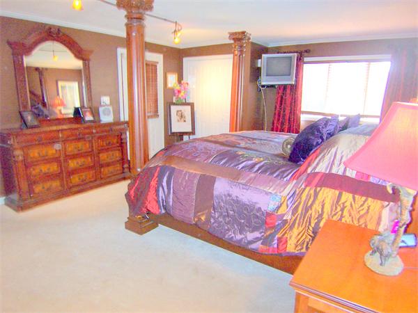 38 Granger Street Springfield, MA 01119 - Photo 19 of 30 a bedroom with a bed and a dresser in it