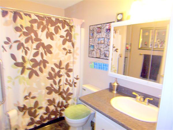 38 Granger Street Springfield, MA 01119 - Photo 20 of 30 a bathroom with a granite countertop sink and a mirror