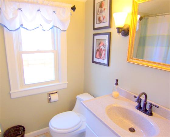 38 Granger Street Springfield, MA 01119 - Photo 23 of 30 a bathroom with a sink vanity mirror and toilet