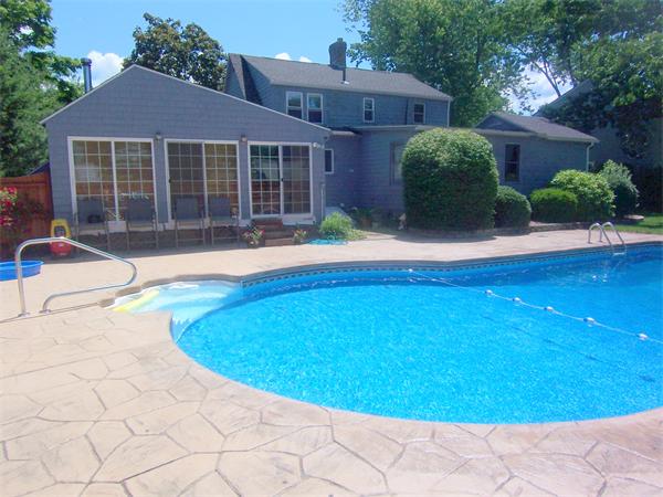 38 Granger Street Springfield, MA 01119 - Photo 30 of 30 a view of a house with a swimming pool and sitting area