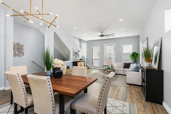a view of a dining room with furniture window and wooden floor