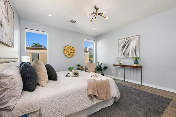 a bedroom with a bed and a table