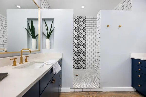 a bathroom with a shower and a sink