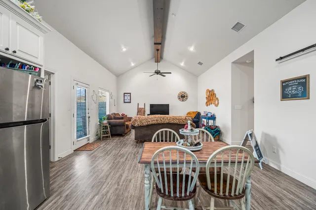 a view of a dining room with furniture window and wooden floor
