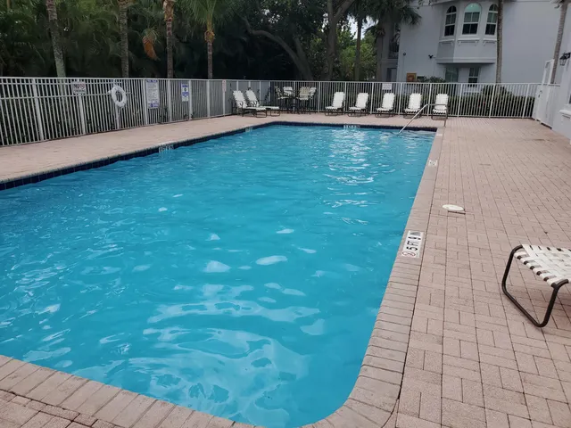 a view of swimming pool with a yard