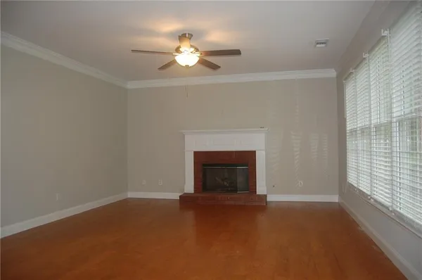 a view of empty room with fireplace