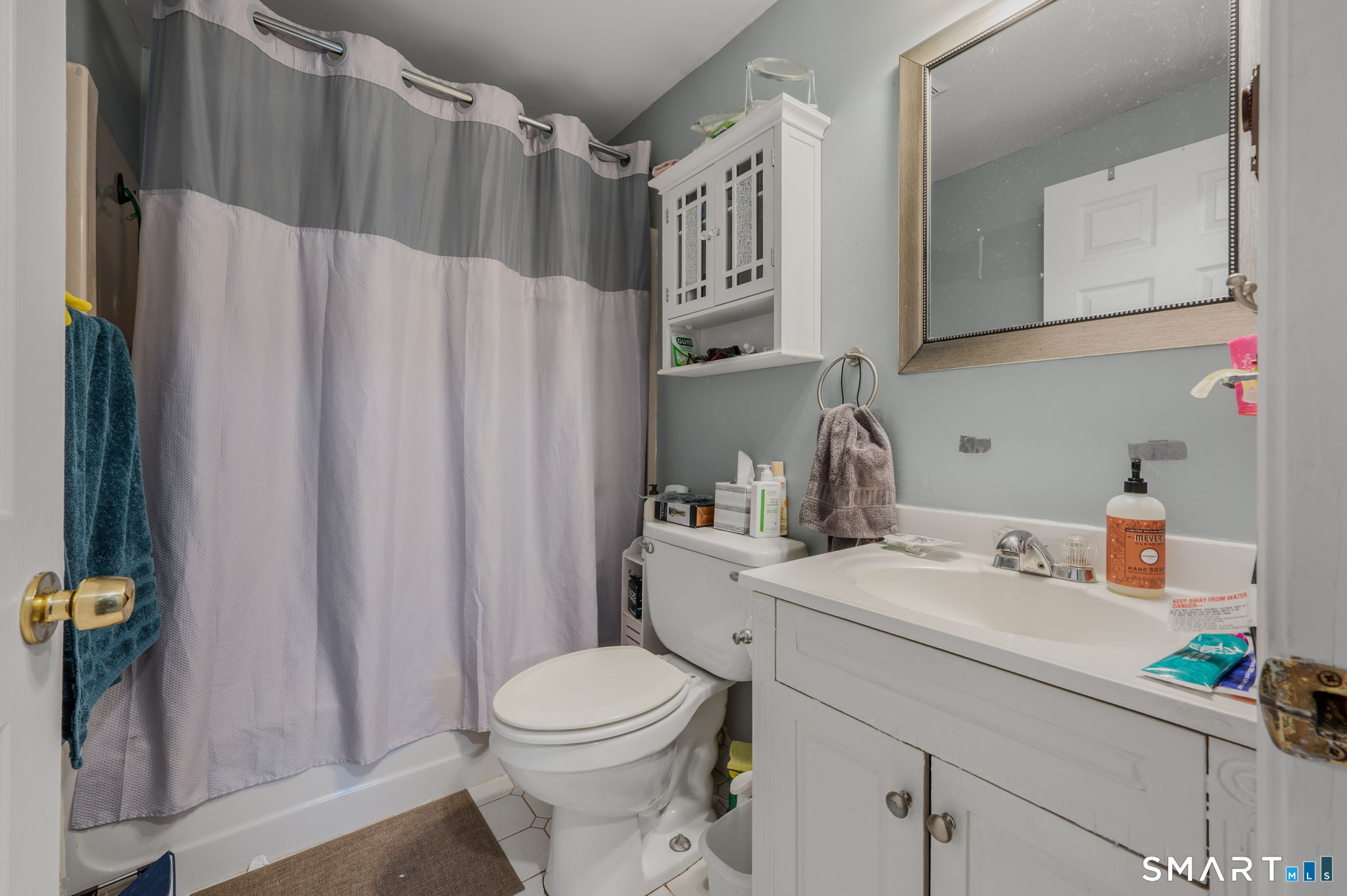 10 Amherst Court Groton, CT 06355 - Photo 15 of 25 a bathroom with a sink a toilet and shower curtain