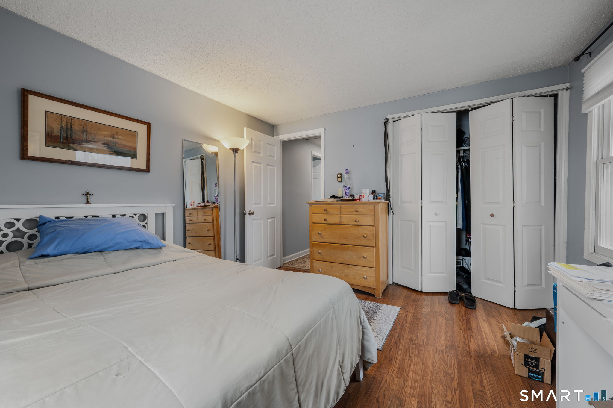 10 Amherst Court Groton, CT 06355 - Photo 17 of 25 a bedroom with a bed and a flat tv screen