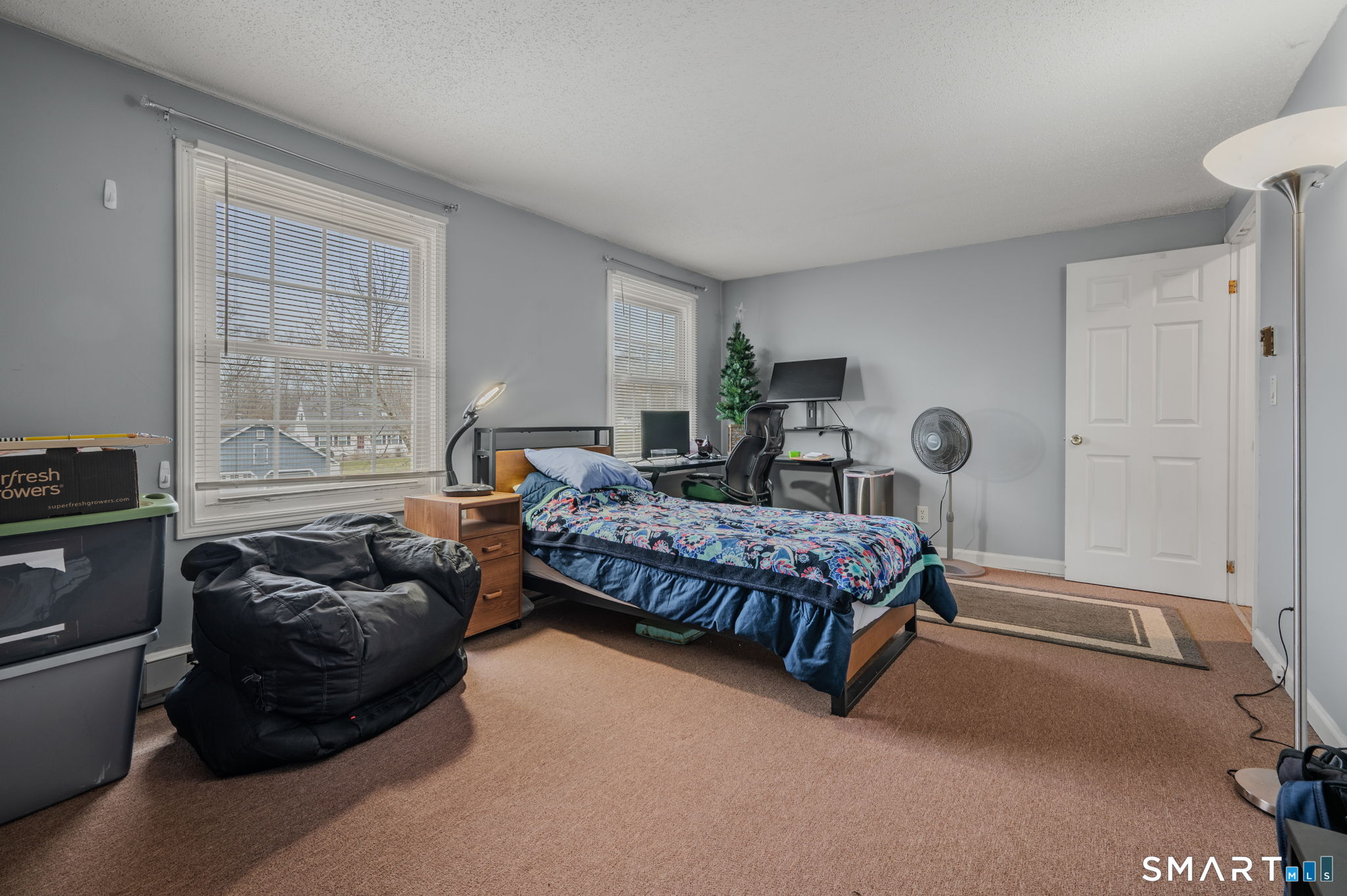 10 Amherst Court Groton, CT 06355 - Photo 19 of 25 a bedroom with a bed and wooden floor