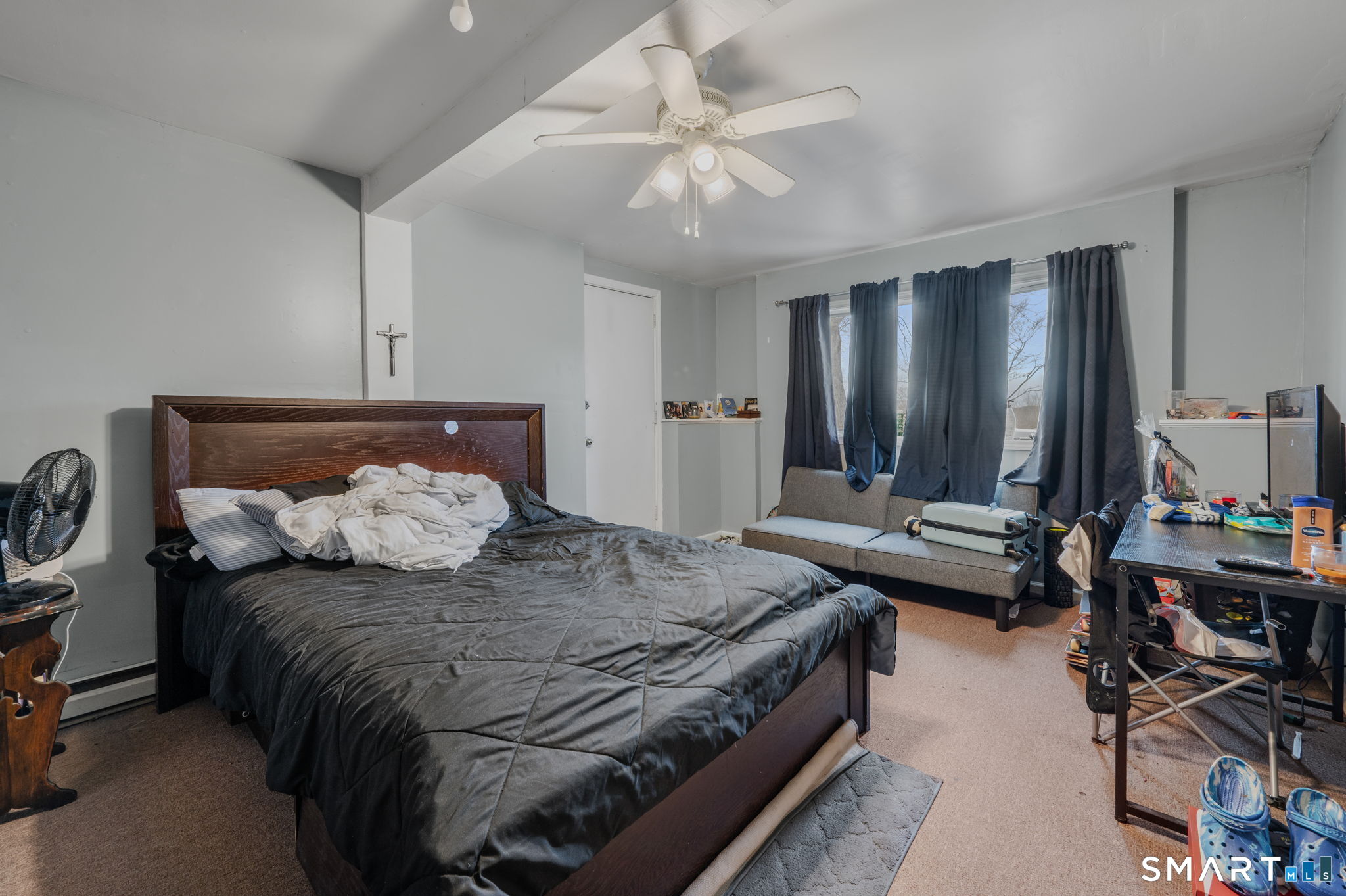 10 Amherst Court Groton, CT 06355 - Photo 20 of 25 a bedroom with a bed and a chandelier