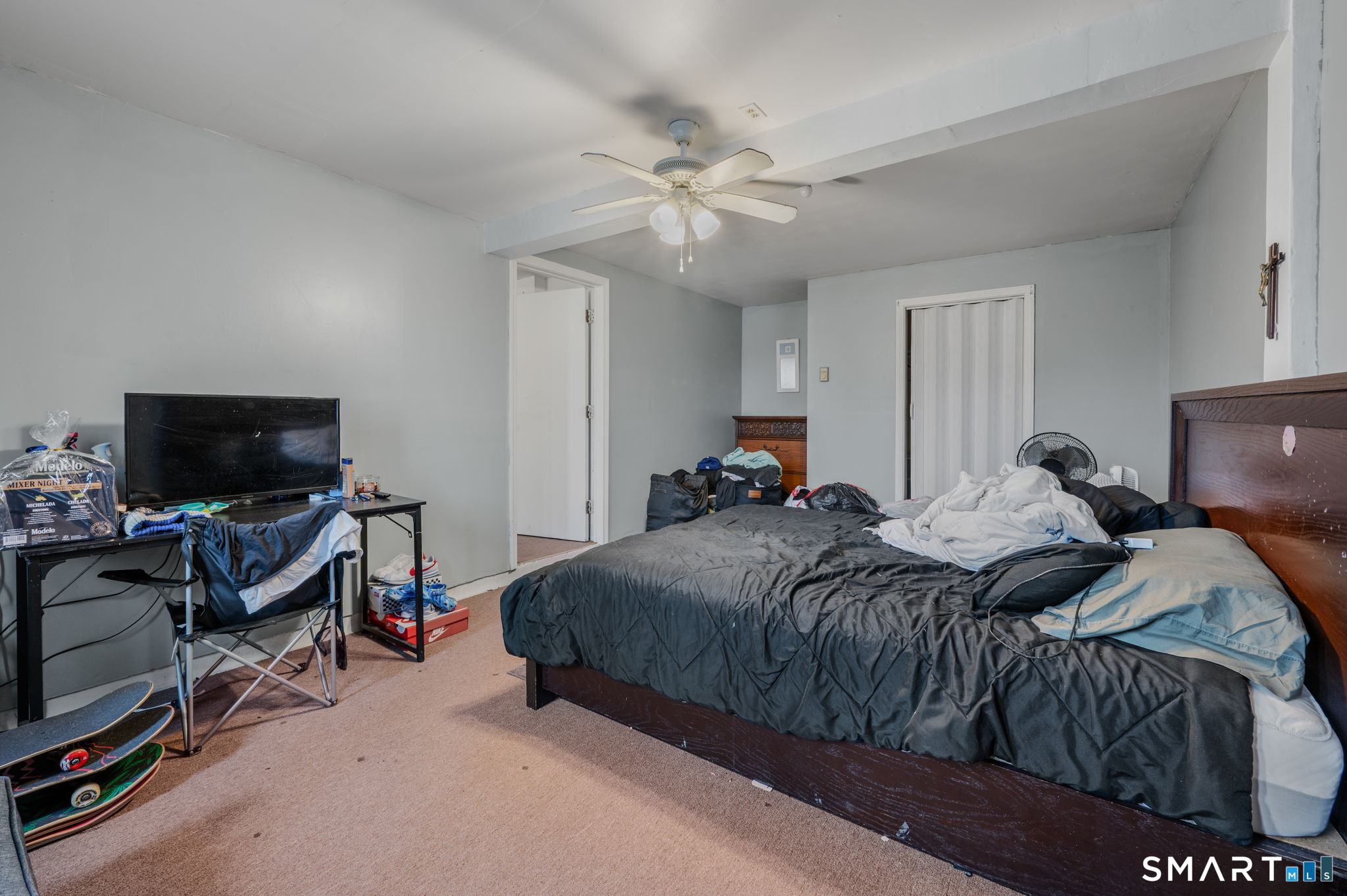 10 Amherst Court Groton, CT 06355 - Photo 21 of 25 a bedroom with a bed and a flat screen tv