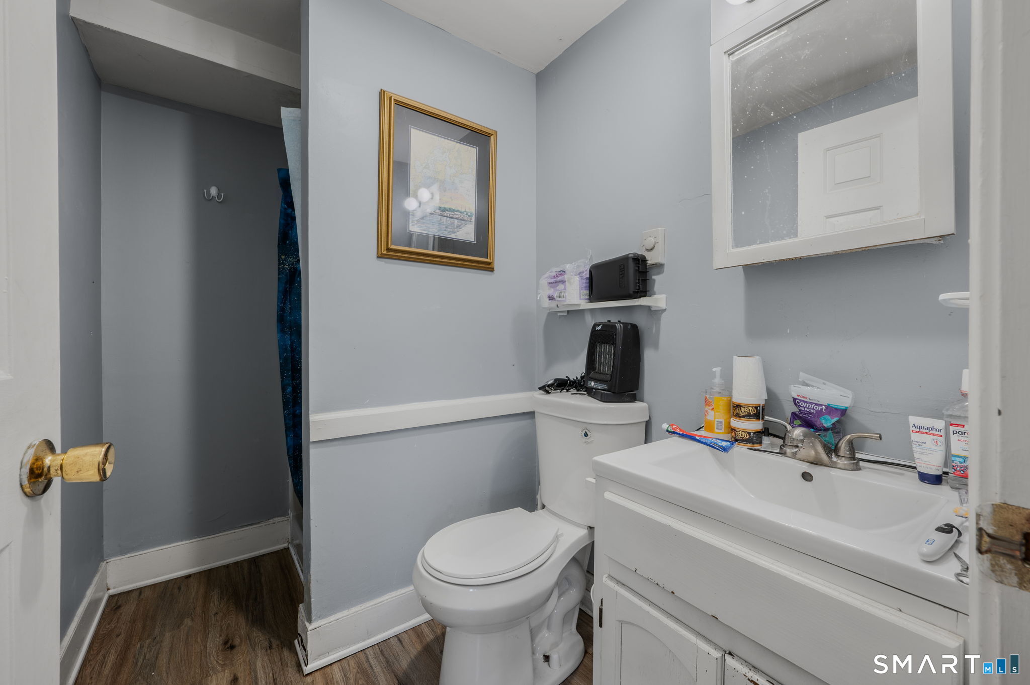 10 Amherst Court Groton, CT 06355 - Photo 24 of 25 a bathroom with a sink toilet and vanity