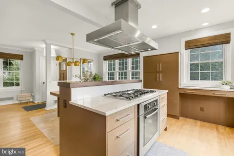 a kitchen with a stove and a sink