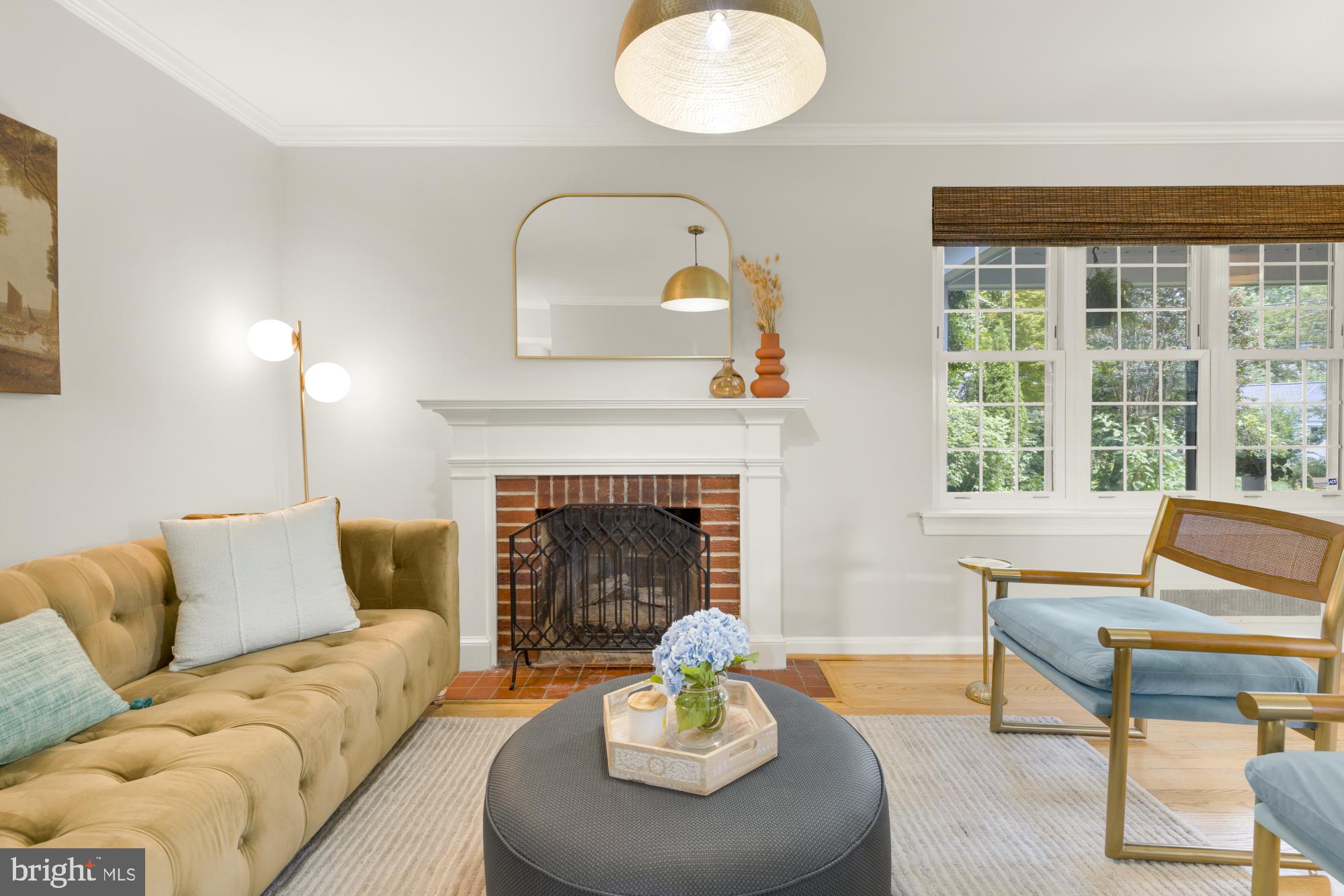 2611 Ross Road Chevy Chase, MD 20815 - Photo 4 of 37 a living room with furniture and a fireplace