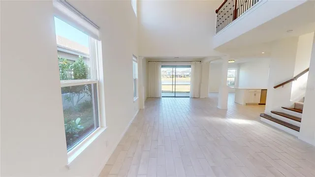 a view of an entryway with wooden floor