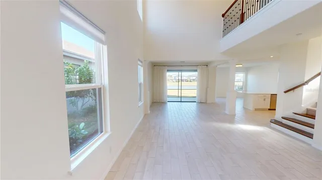a view of an entryway with wooden floor