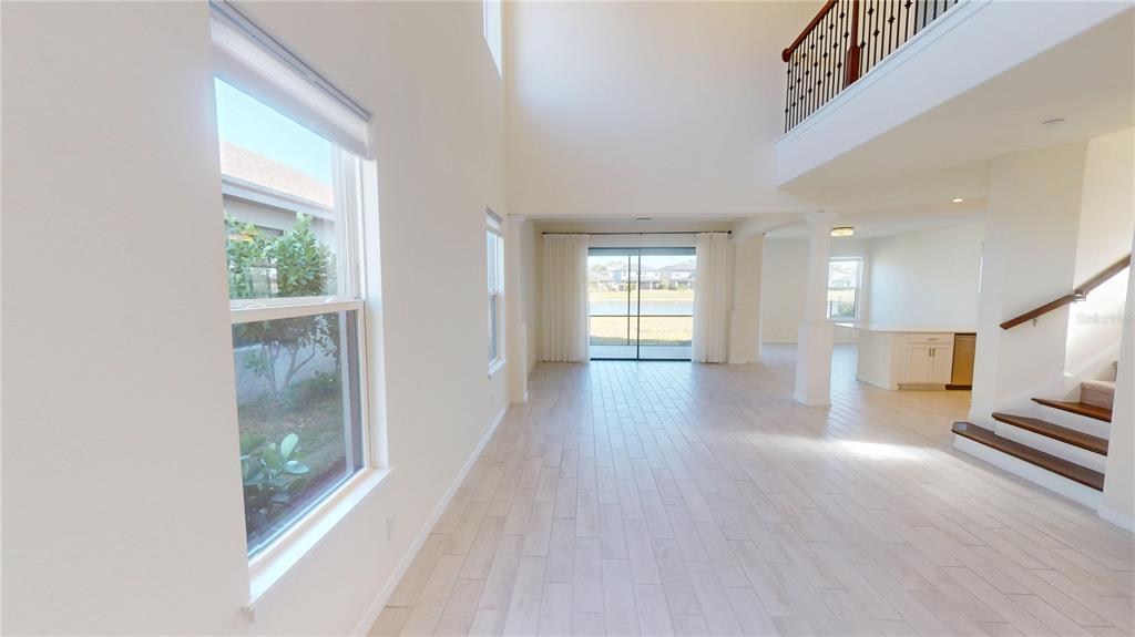 5521 Summit Glen Bradenton, FL 34203 - Photo 16 of 54 wooden floor in an empty room with a window