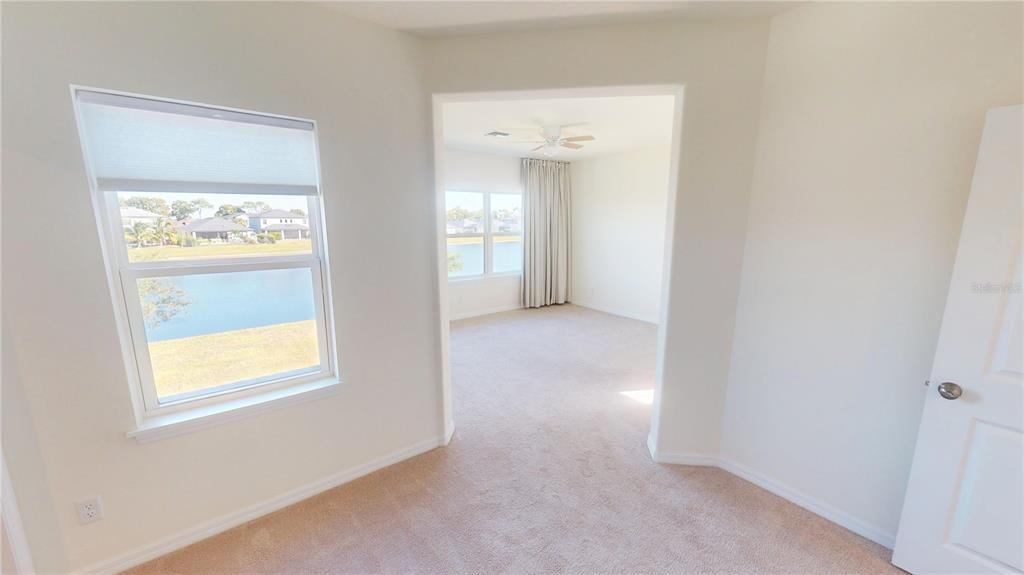 5521 Summit Glen Bradenton, FL 34203 - Photo 32 of 54 a view of an empty room with a window