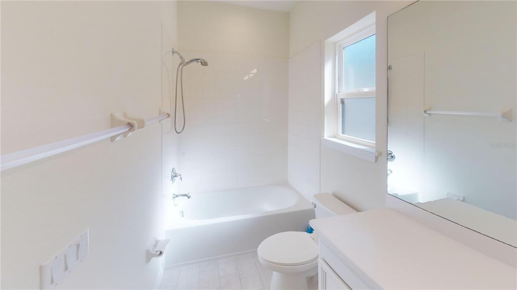 5521 Summit Glen Bradenton, FL 34203 - Photo 36 of 54 a bathroom with a toilet and a bathtub