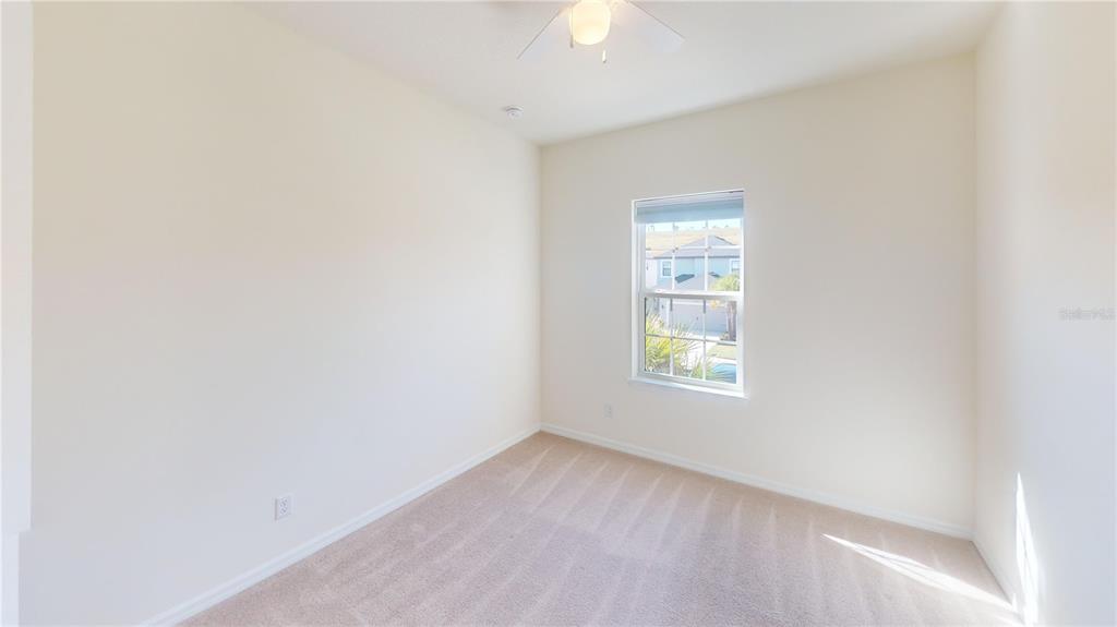 5521 Summit Glen Bradenton, FL 34203 - Photo 39 of 54 an empty room with a window