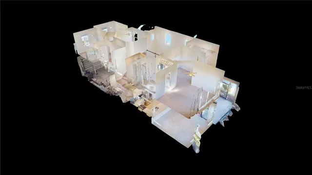 a kitchen with stainless steel appliances white cabinets and a refrigerator
