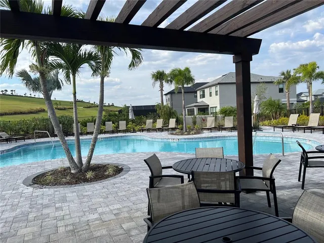 a view of a patio with swimming pool
