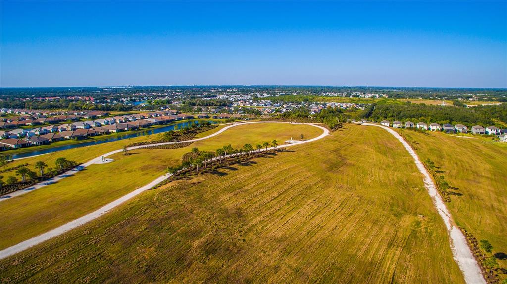 5521 Summit Glen Bradenton, FL 34203 - Photo 48 of 54 a view of a swimming pool and an outdoor seating