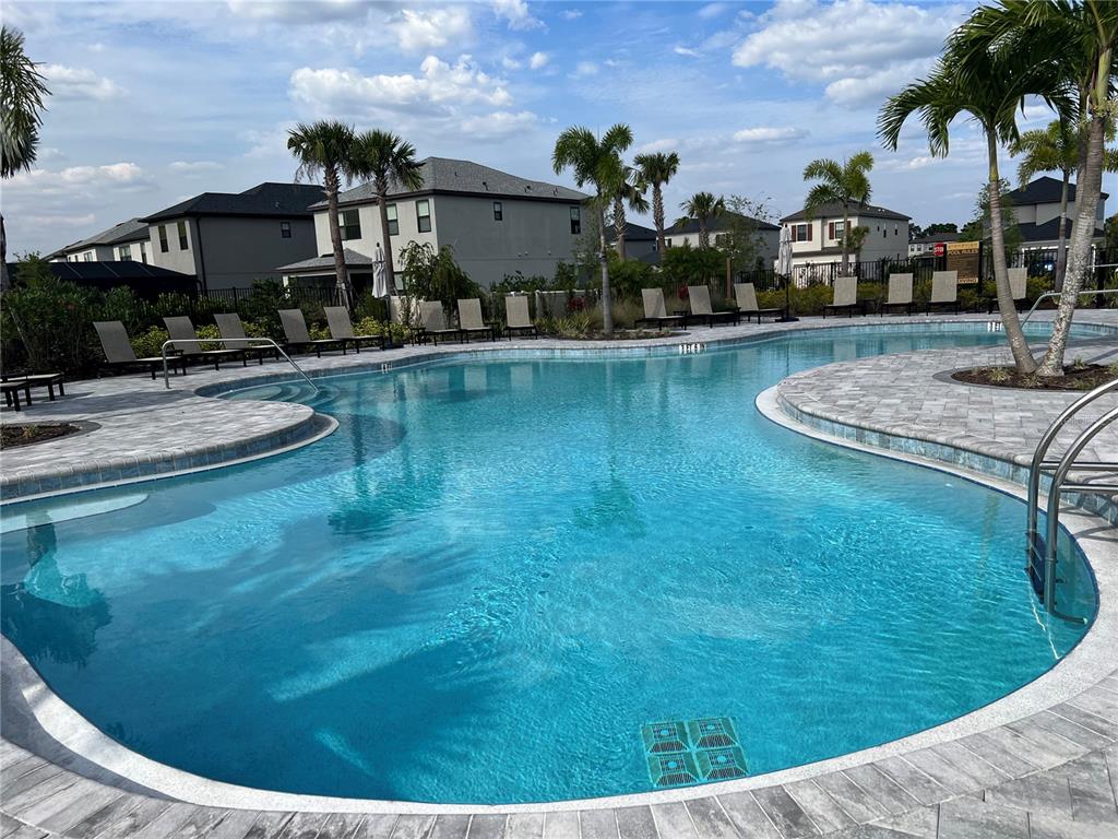 5521 Summit Glen Bradenton, FL 34203 - Photo 5 of 54 a swimming pool with outdoor seating and yard