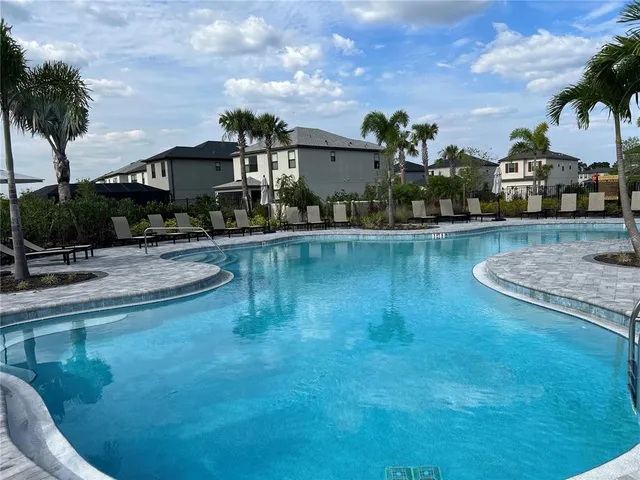 a view of a house with swimming pool