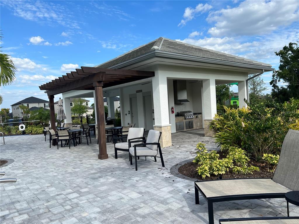 5521 Summit Glen Bradenton, FL 34203 - Photo 7 of 54 a view of a house with sitting area and garden