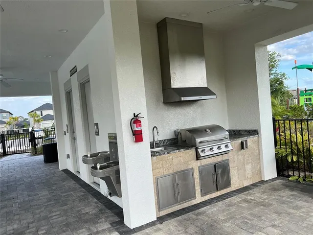 a kitchen with stainless steel appliances a stove and a refrigerator