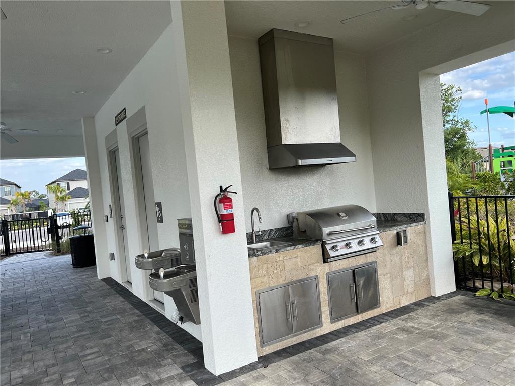 5521 Summit Glen Bradenton, FL 34203 - Photo 8 of 54 a kitchen with stainless steel appliances a stove and a refrigerator
