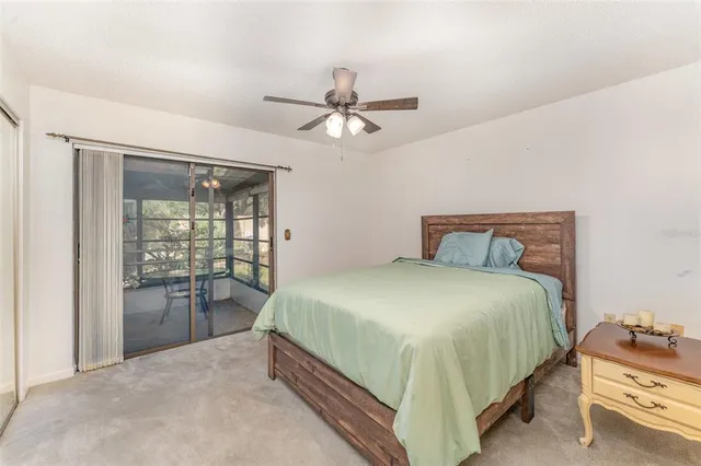 a bedroom with a bed and a table with closet