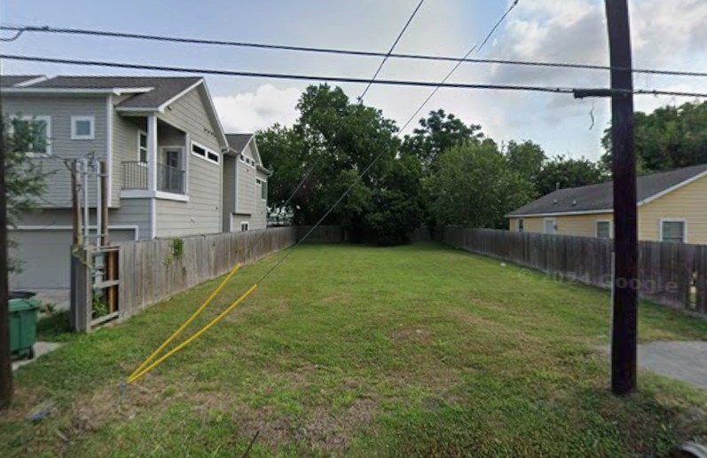 a view of a backyard with potted plants