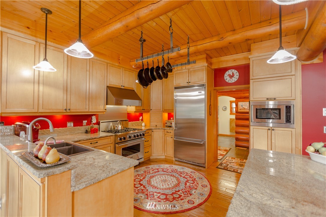12057 Havekost Road Anacortes, WA 98221 - Photo 21 of 40 a kitchen with stainless steel appliances granite countertop a sink and cabinets