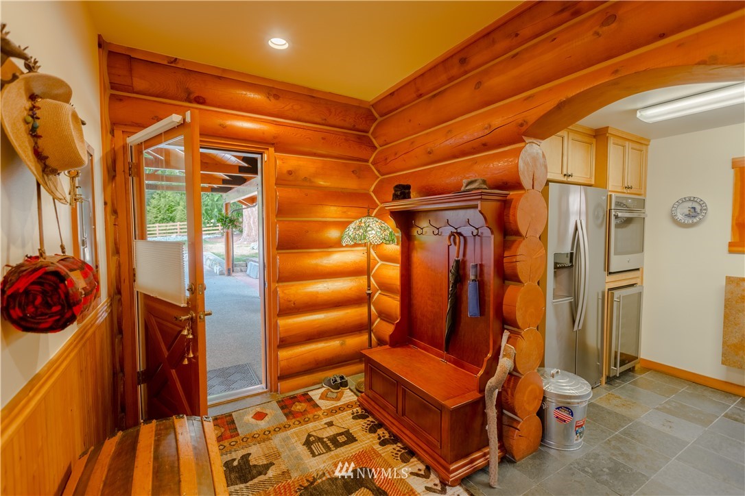 12057 Havekost Road Anacortes, WA 98221 - Photo 26 of 40 a view of walk in closet with clothes and shoes