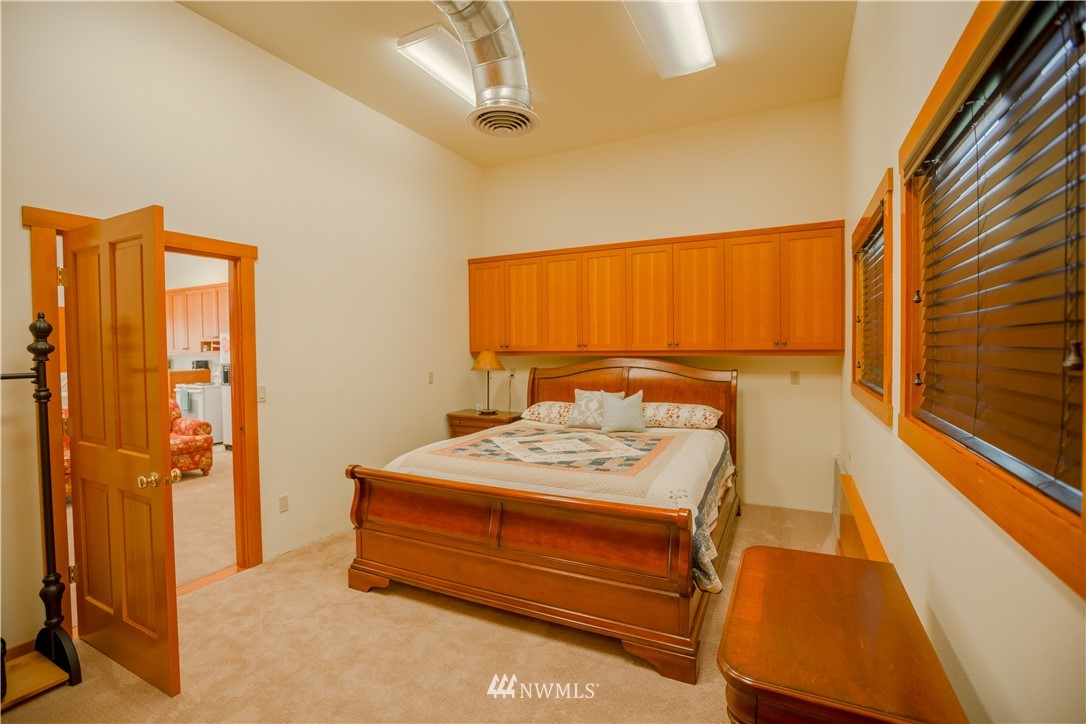 12057 Havekost Road Anacortes, WA 98221 - Photo 40 of 40 a bedroom with a bed and a window