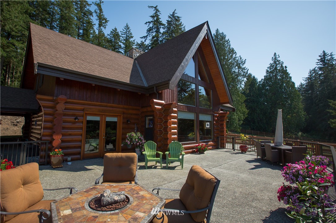 12057 Havekost Road Anacortes, WA 98221 - Photo 7 of 40 a view of a patio with table and chairs and potted plants