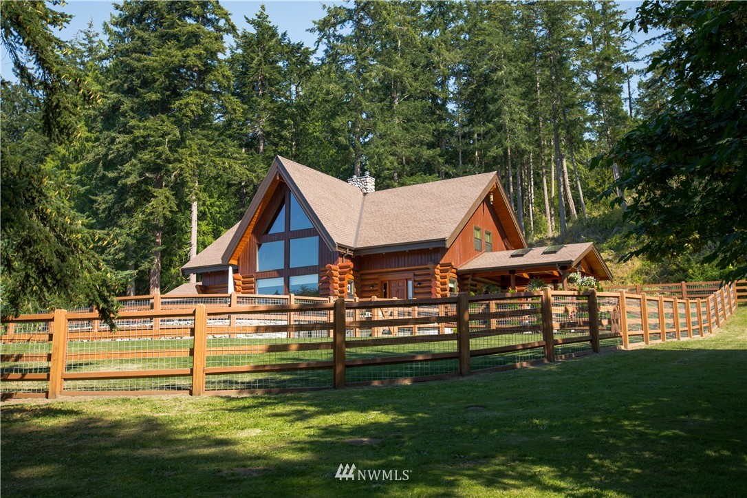 12057 Havekost Road Anacortes, WA 98221 - Photo 8 of 40 a view of a house with a yard