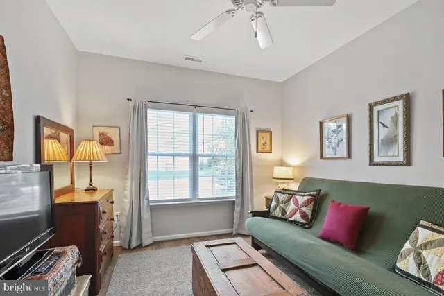 a kitchen with granite countertop a refrigerator stove and sink