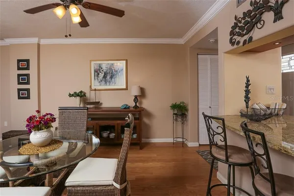 a living room with furniture and flowers