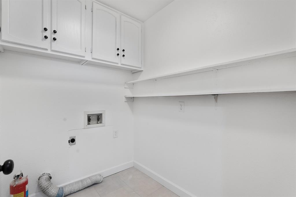 2009 Sandberg Drive, Unit 159 Austin, TX 78752 - Photo 13 of 28 Laundry with storage