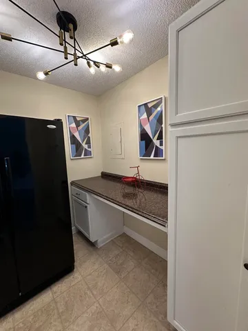 a view of room with window and furniture