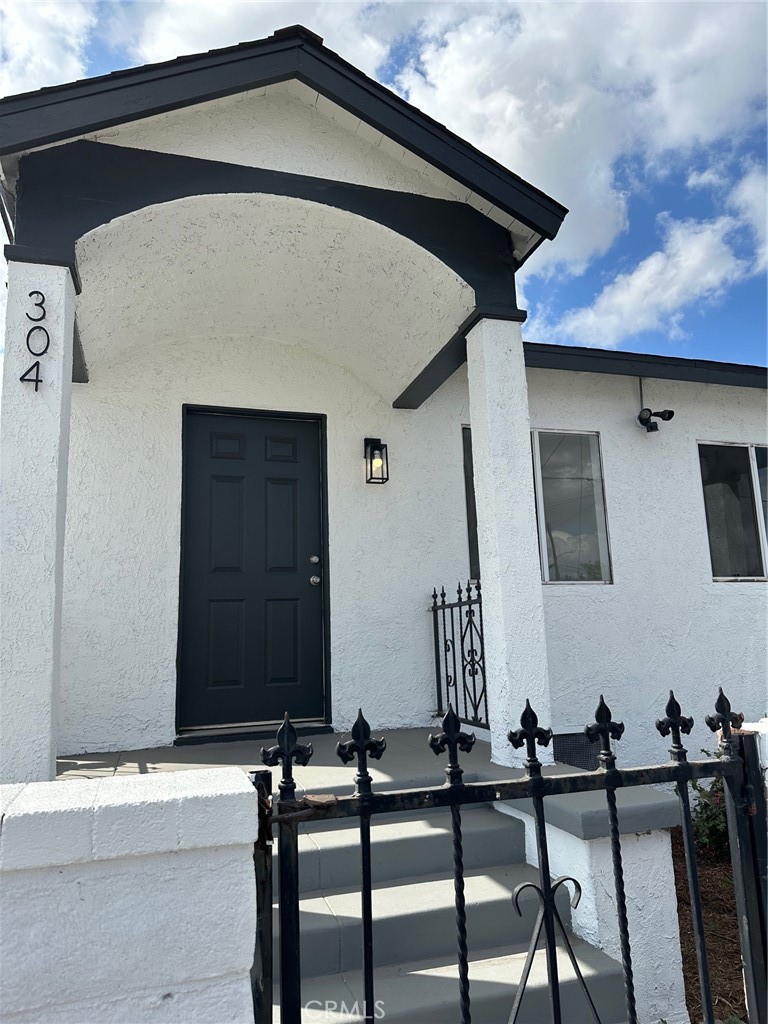 a front view of a house with sitting area