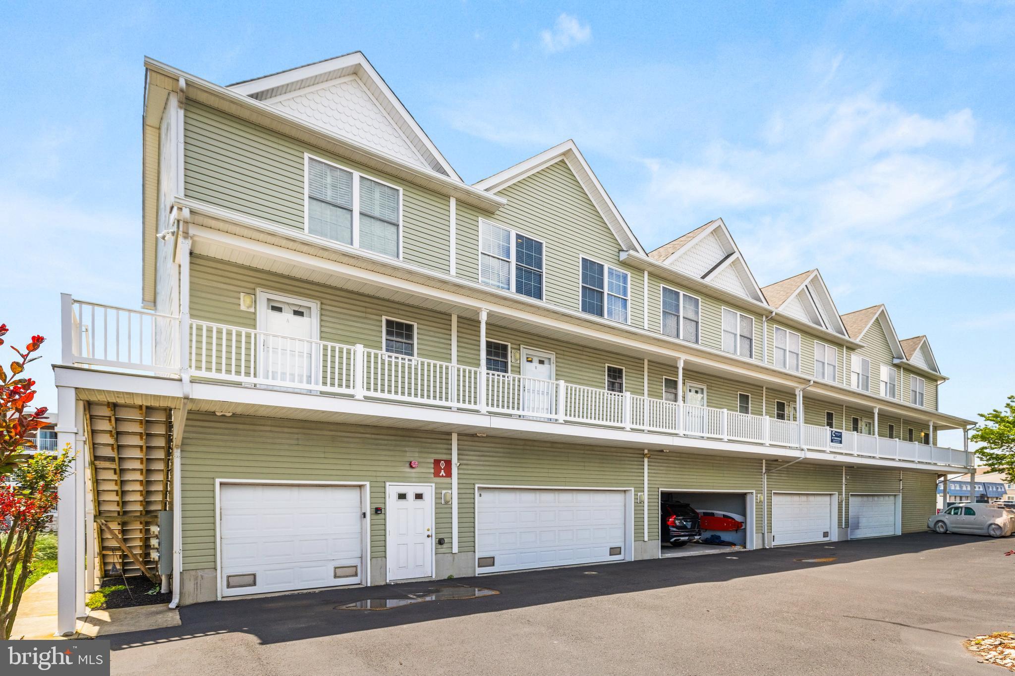 617 Salt Spray Road, Unit B Ocean City, MD 21842 - Photo 36 of 72 a front view of a building with a street