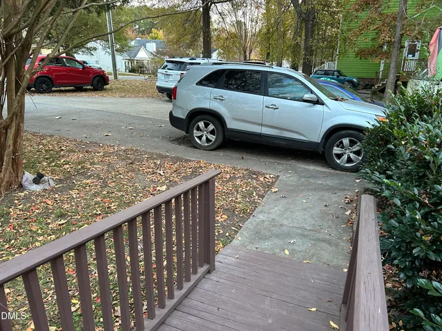 a front view of a house with parking space